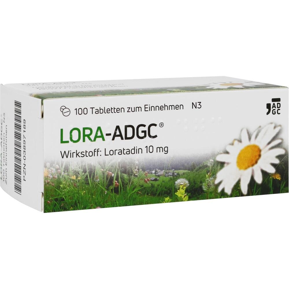 Weiße Medikamentenverpackung mit einer großen Blume und grüner Wiese.